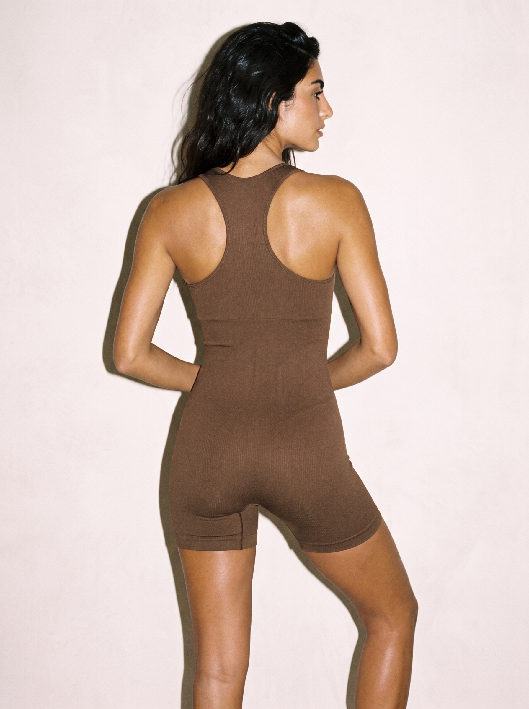 Seamless Motion One-Piece in Brown, back view showing racerback